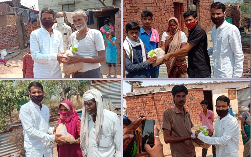 representatives of kute group foundation distributing food grains to villagers in beed