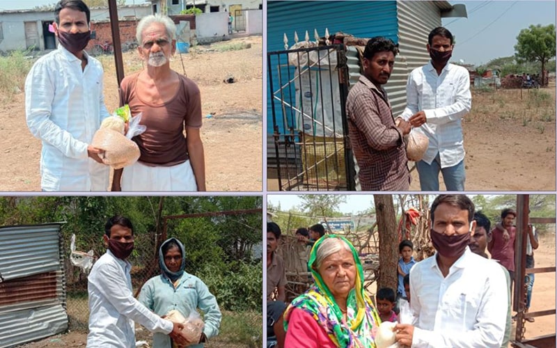 villagers in beed district receiving food items donated by kute group foundation
